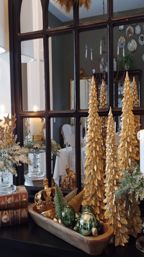 gold trees and christmas ornaments with a dough bowl