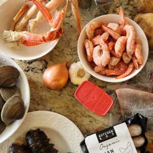 seafood boill ingredients shrimp, clams, lobster and king crab