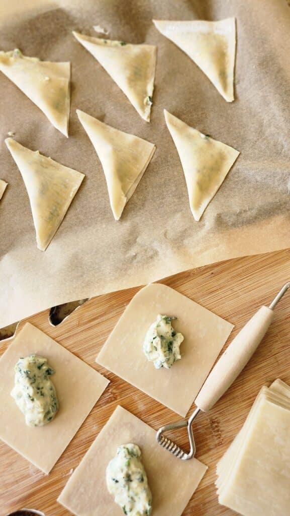 triangles of spinach ricotta being made