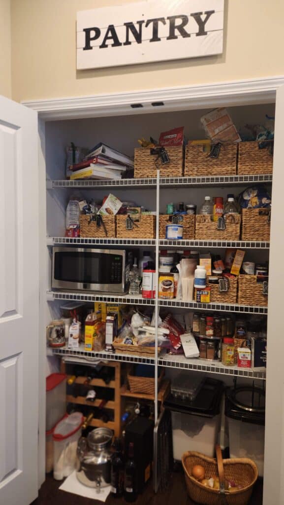 messy pantry shelves with wicker baskets