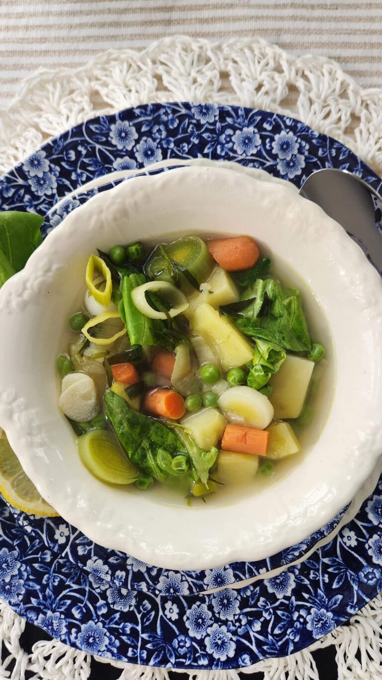 vegetable soup with spring lettuce in bowl