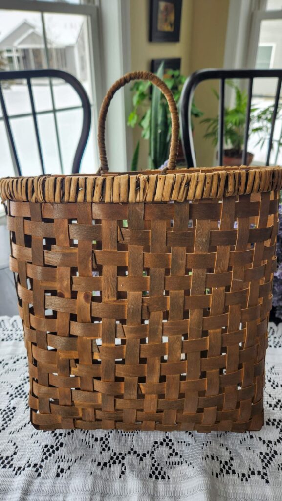 wicker basket with handle on table