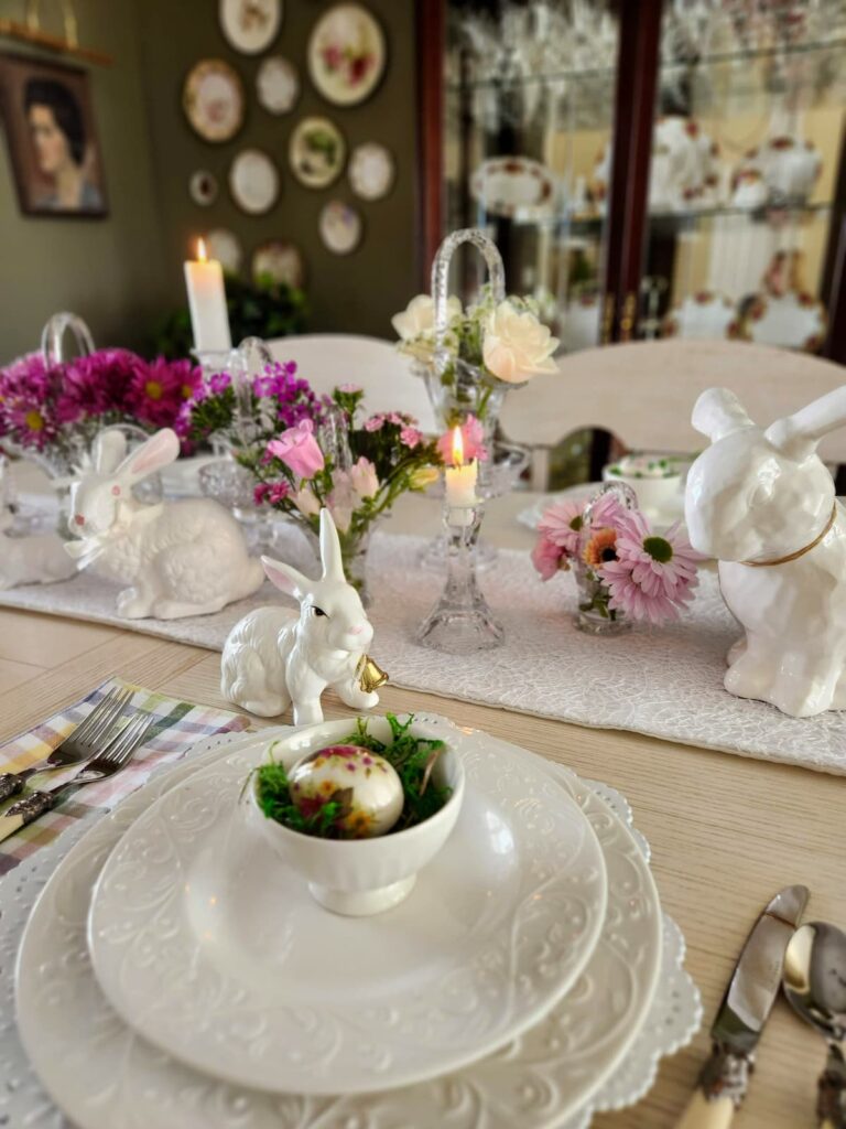 white dishes with pink flowers in crystal vases for easter