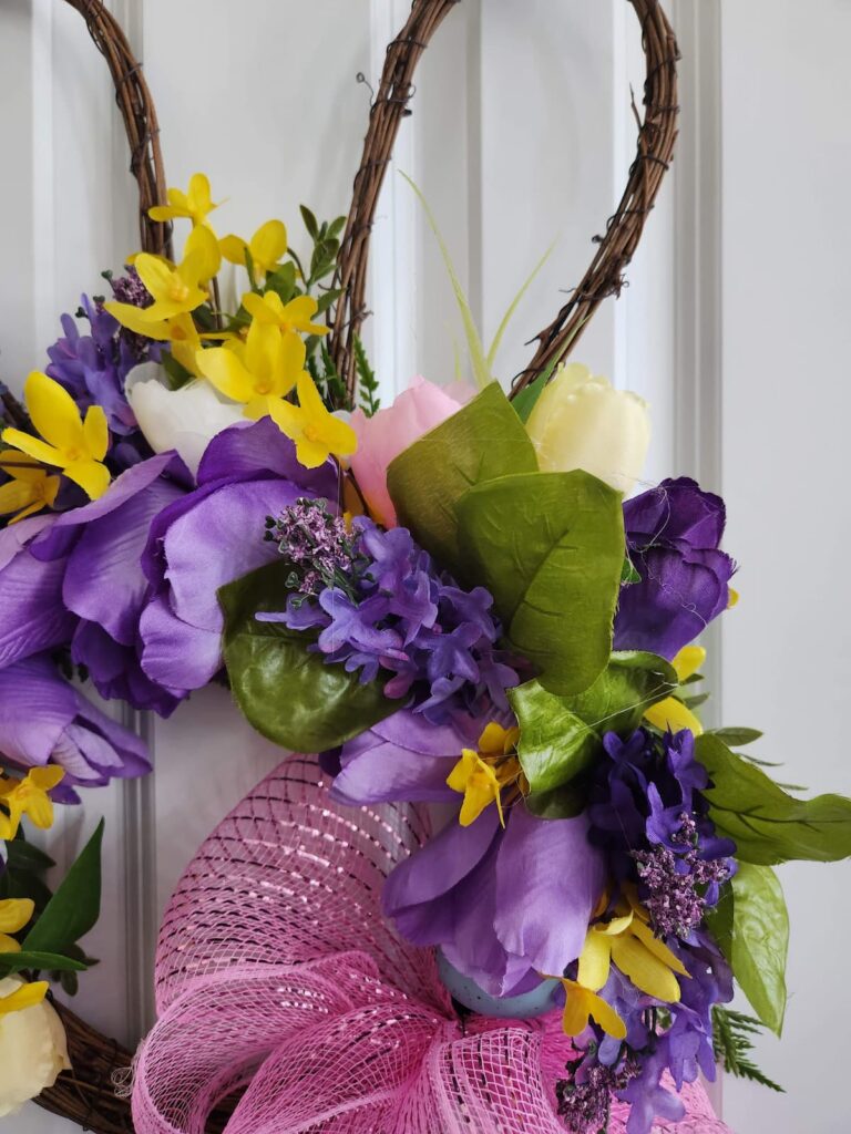 close up of bunny wreath with added flowers