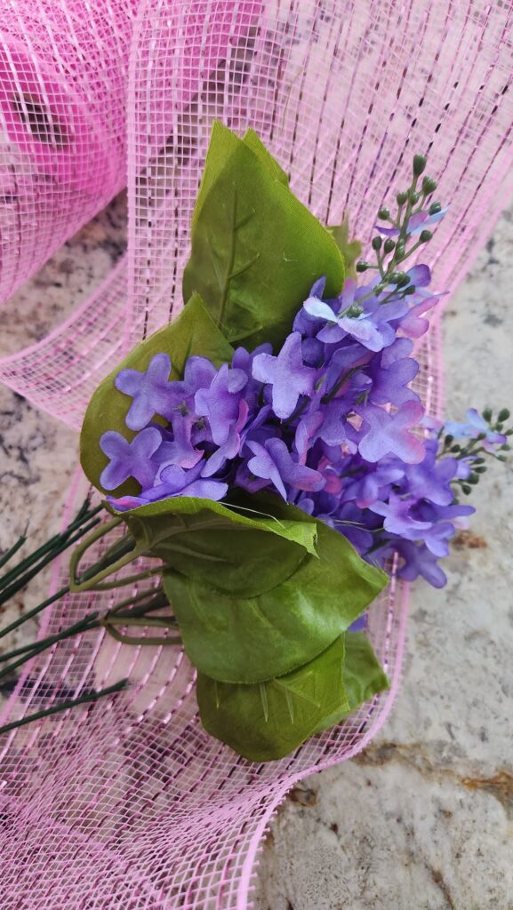 faux flower stems with green leaves
