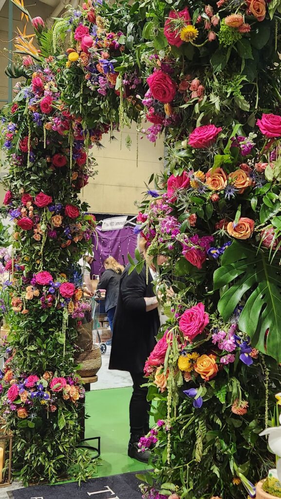 flower arch filled with real flowers at garden expo