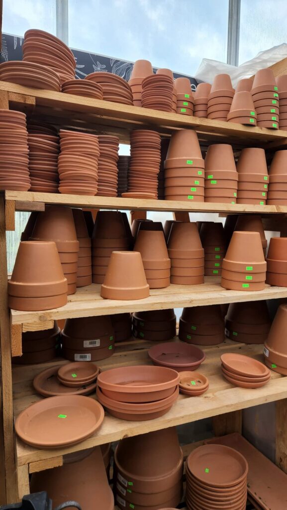 terra cotta pots on shelf