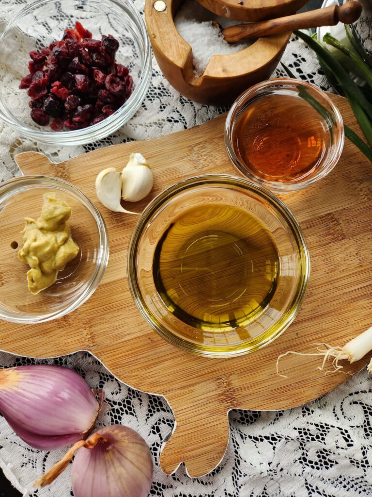 ingredients in glass bowls to make green beans with cranberries and shallots