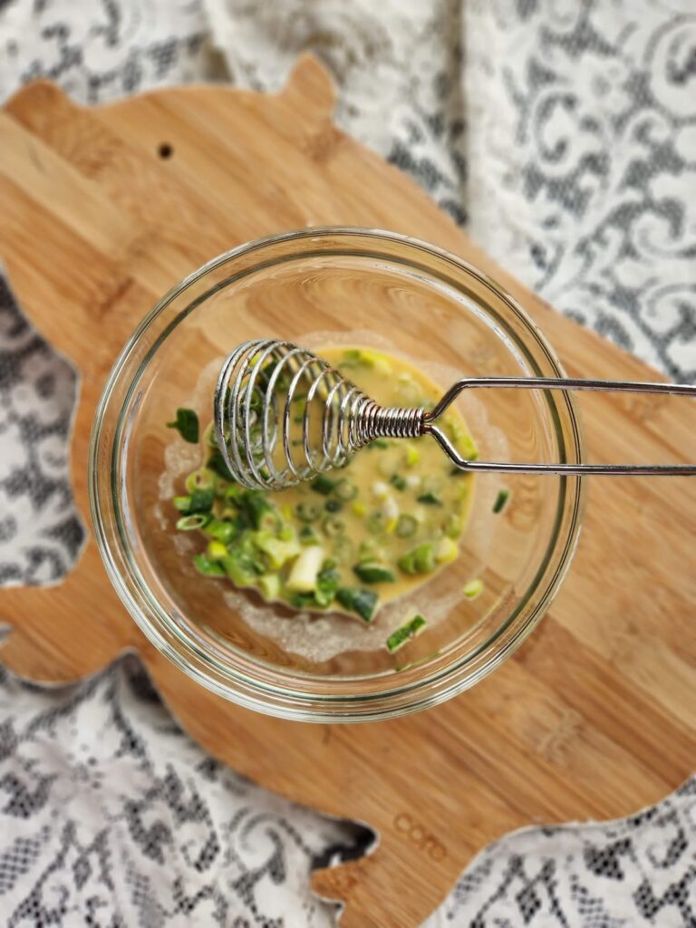 overhead view of mustard dressing being made and whisk