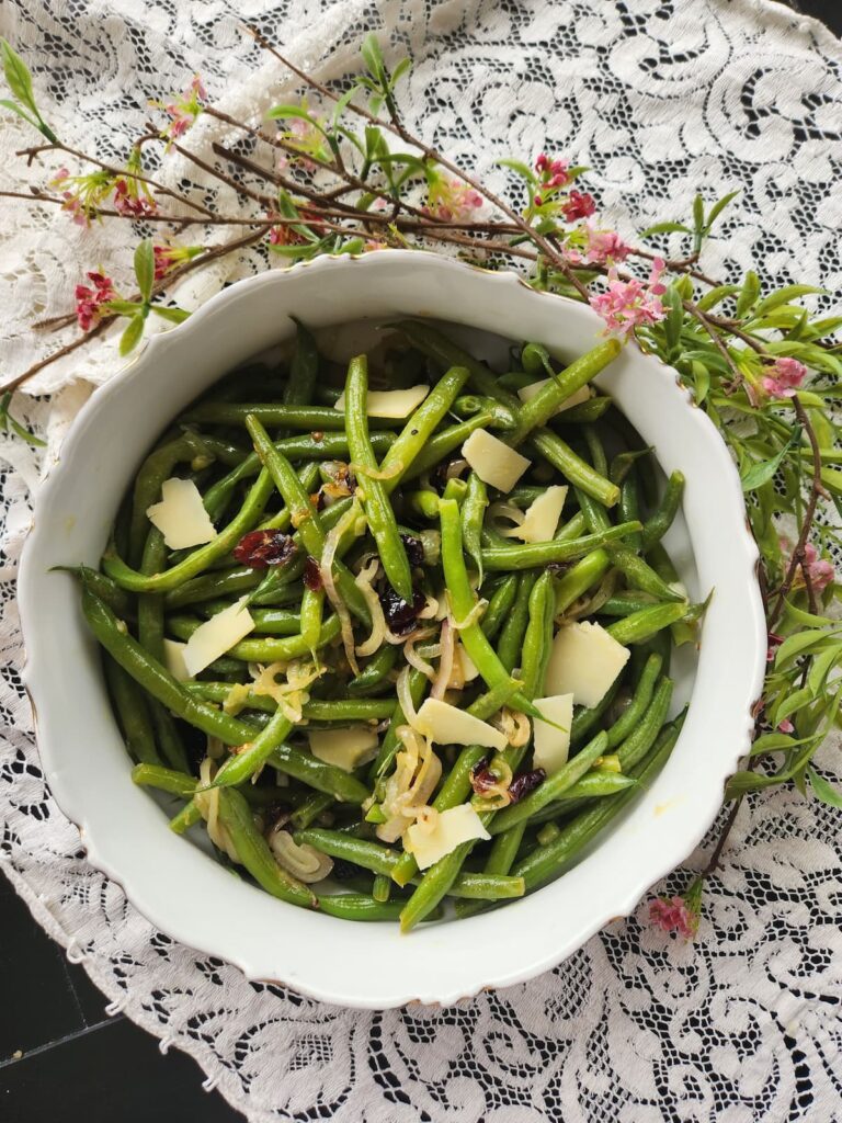 overhead view of vegetarian green bean recipe in vintage bowl