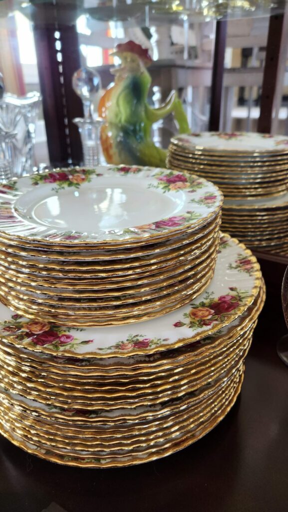 stack of fine china dishes in a hutch
