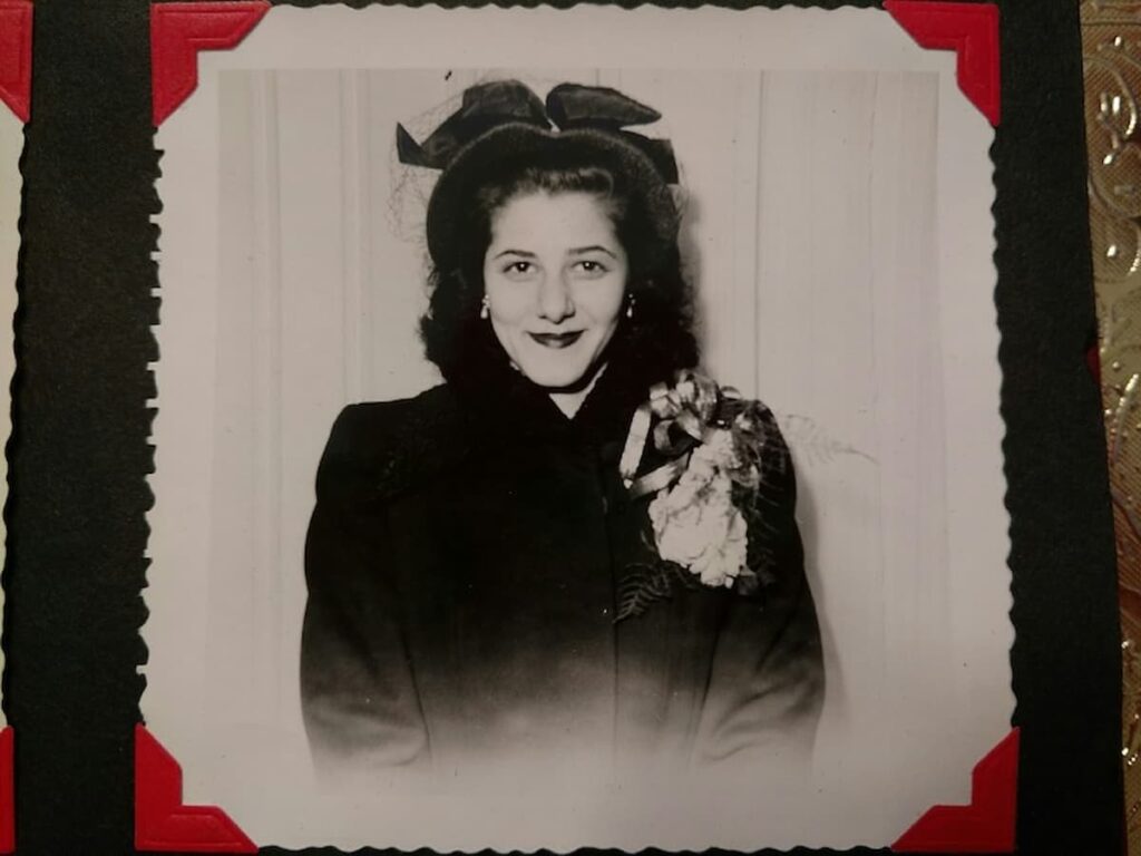 beautiful black and white photo of lady with easter corsage and easter hat on