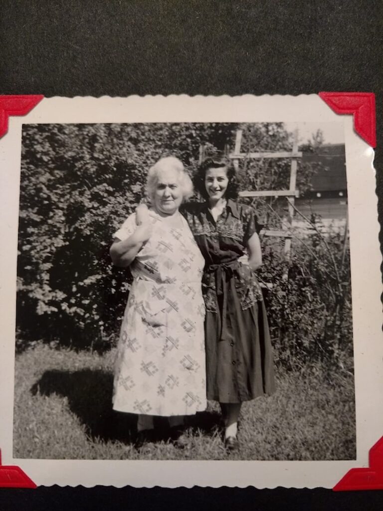 grandmother and mother in garden smiling