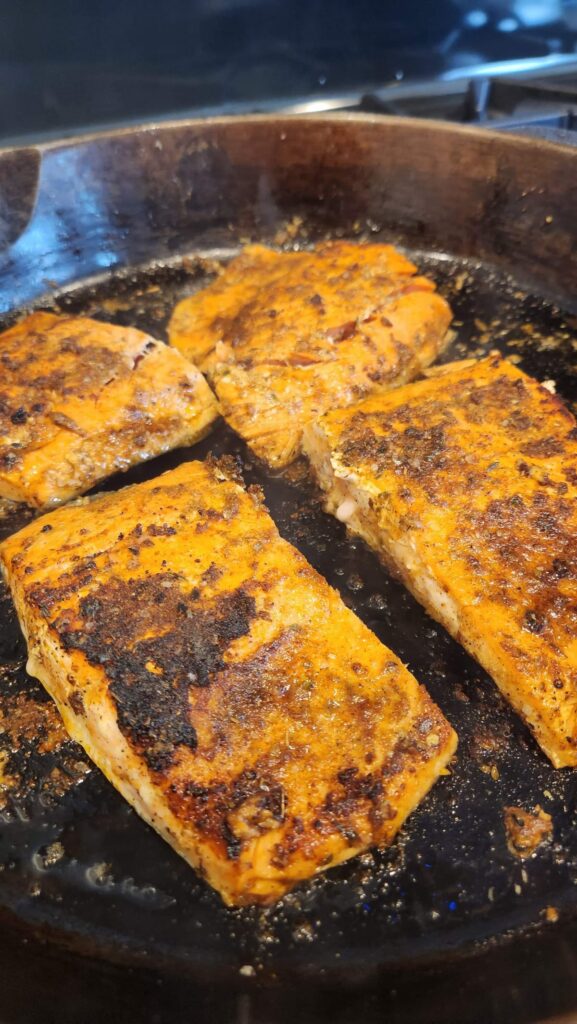 salmon in cast iron skillet skin side down