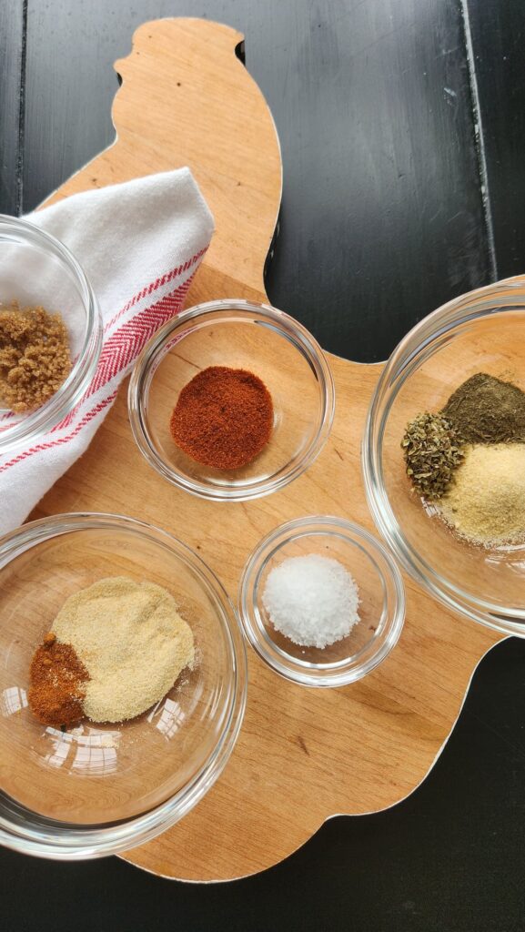 overhead shot of spices in clear glass bowls