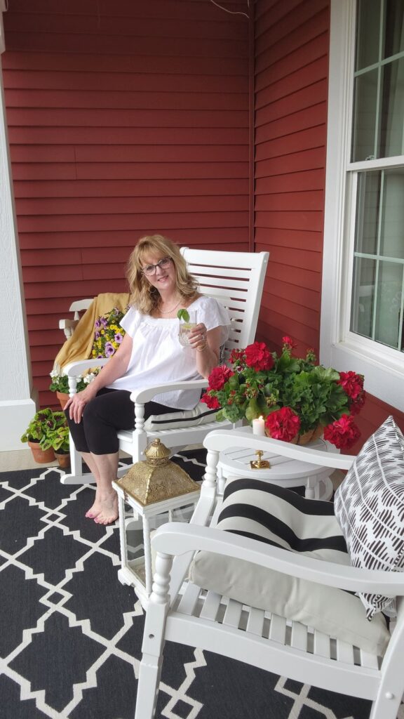 lady sitting on porch drinking lemon water