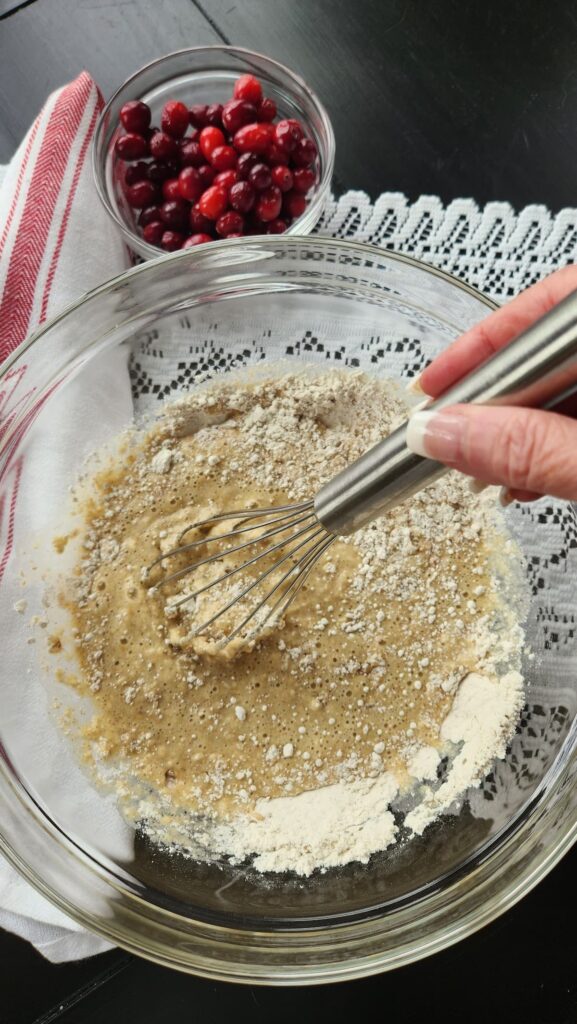 glass bowl with batter being mixed