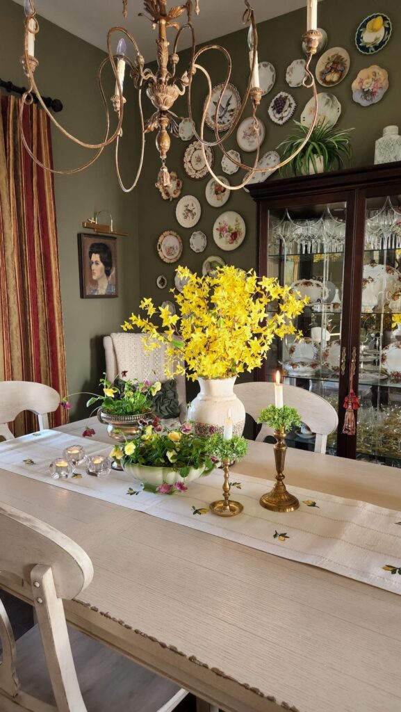 yellow forsythia branches on dining room table