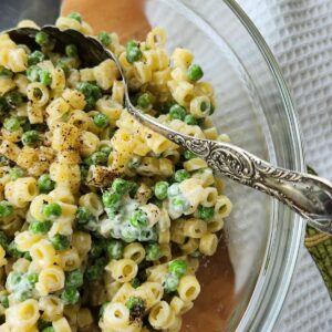pasta and pea salad in glass bowl