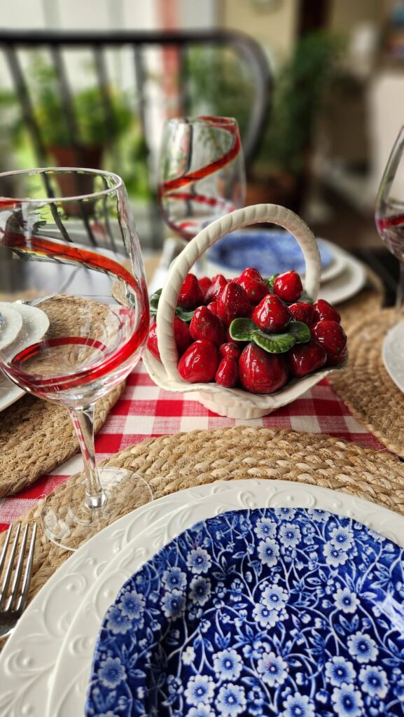 jute placemat with ceramic basket with ceramic strawberries in it