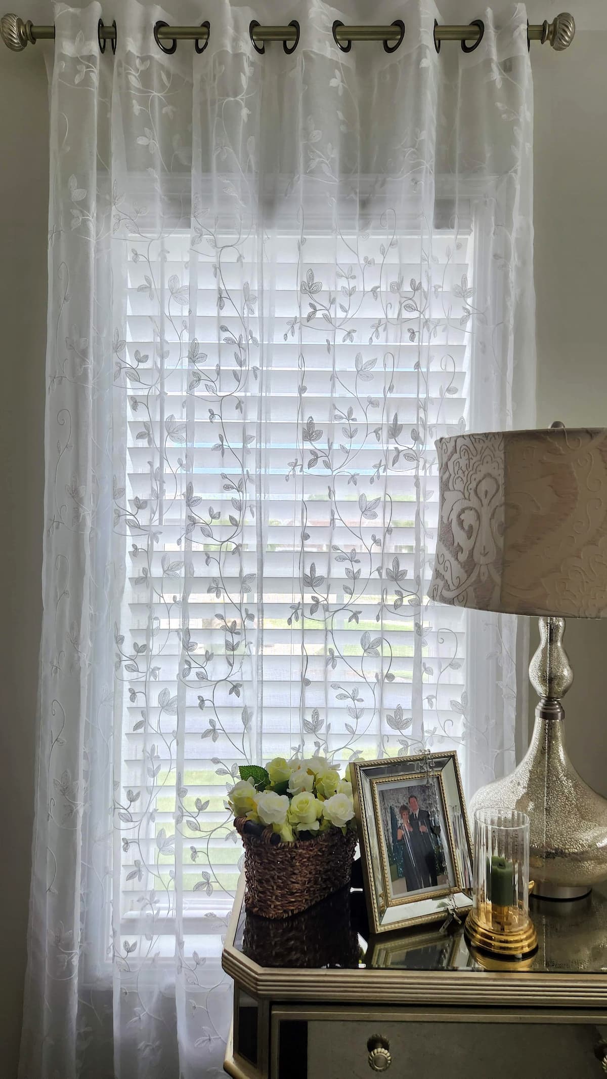 clean sheer curtains hung up in bedroom