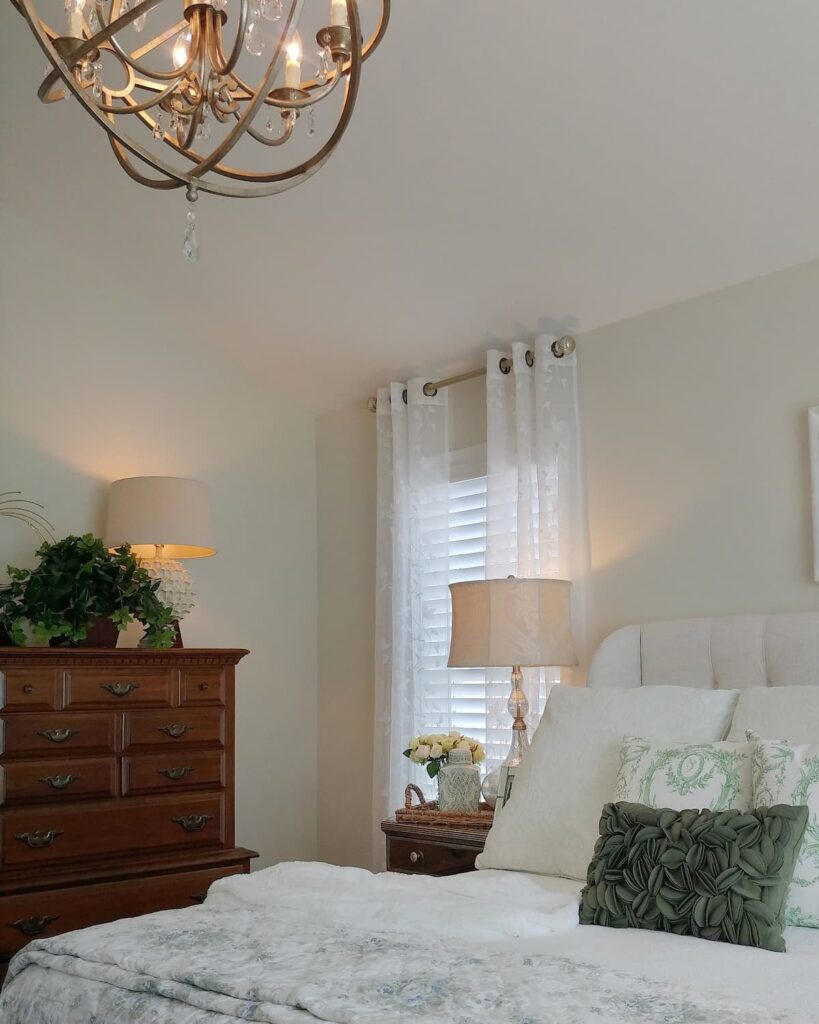 view of bedroom with crisp white sheer curtains