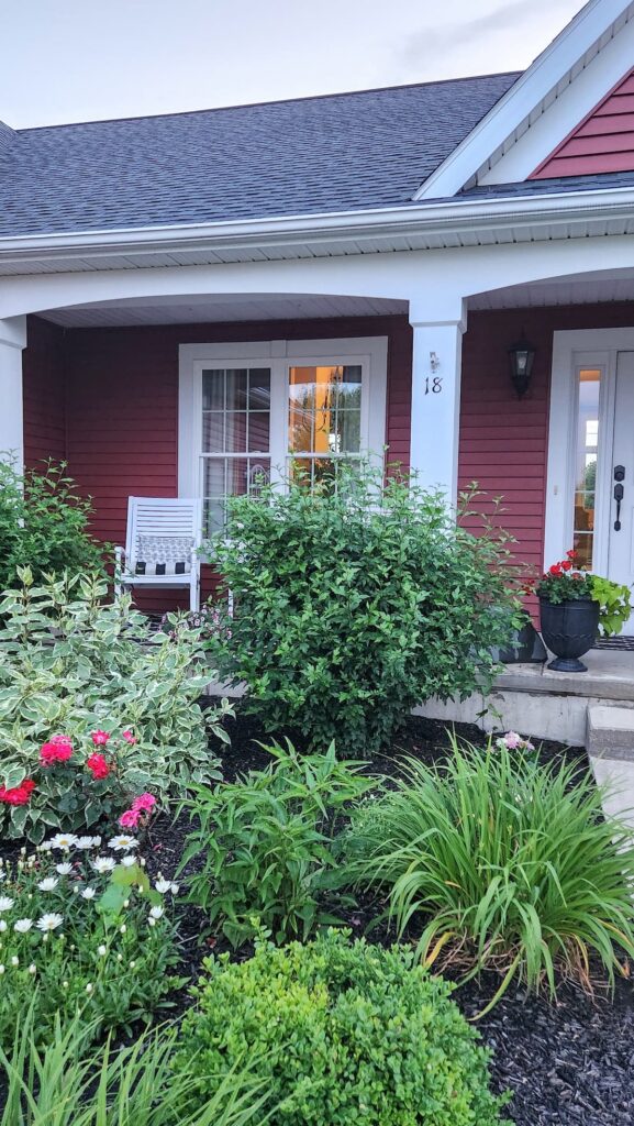 front porch view of white rocking chairs