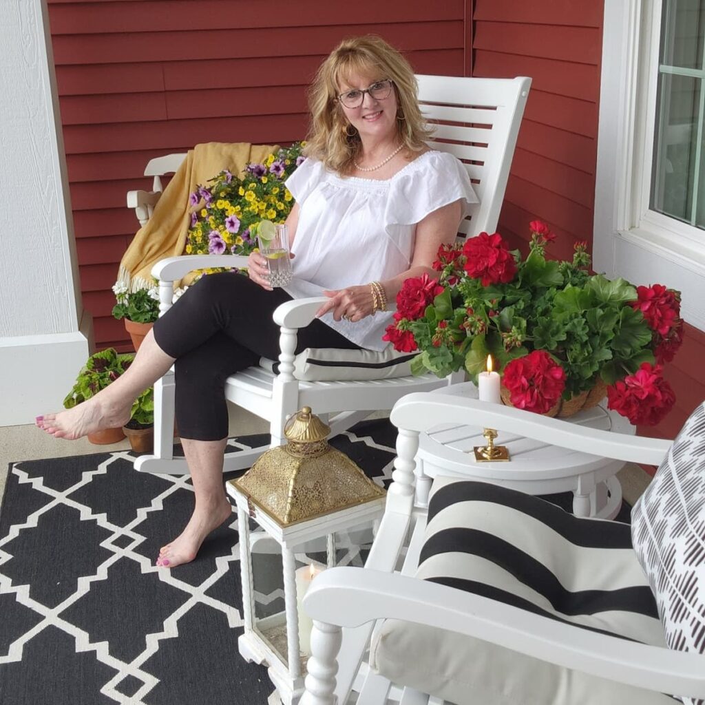 Me sitting on front porch in white rocking chair