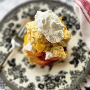 overhead view of shortcake with nectarines and whipped cream