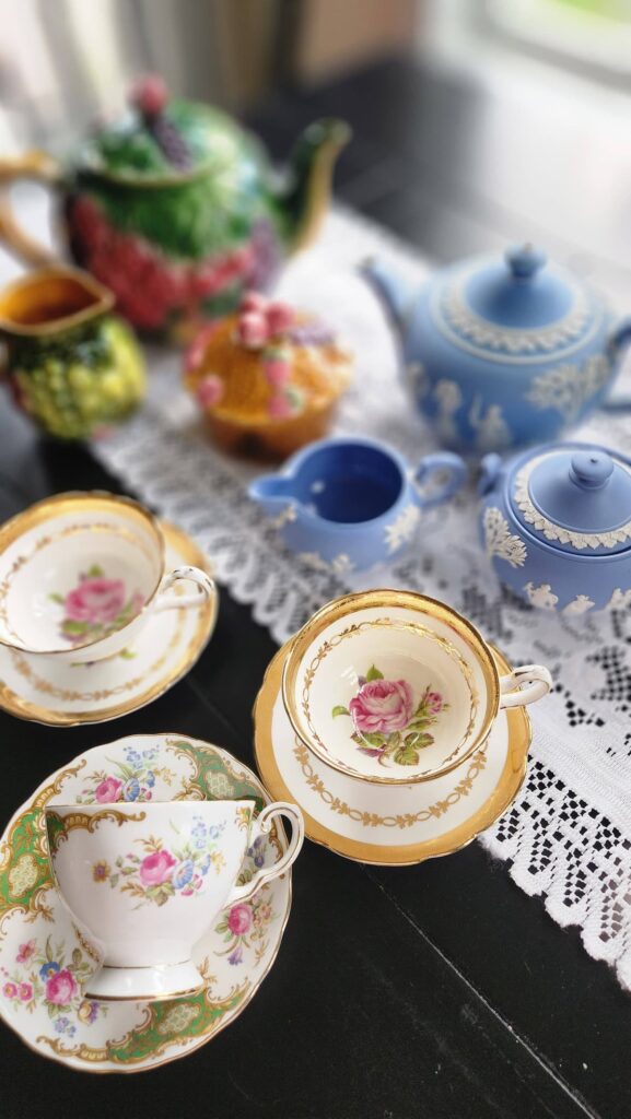 overhead view of vintage teacups and teapots from and estate sale