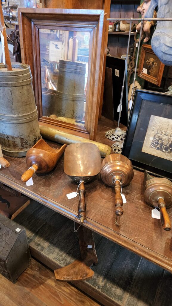 vintage wooden scoops in a antique shop