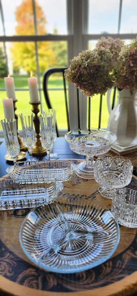 crystal dishes and serving plates on breakfast room kitchen table