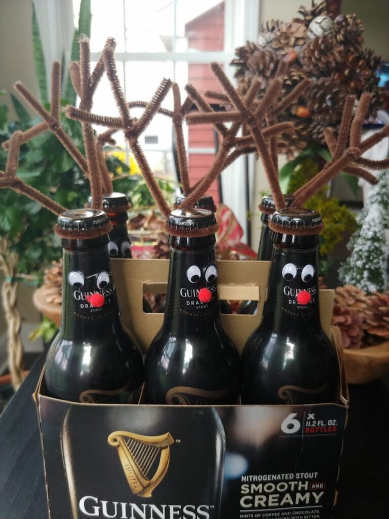 six pack of bottle with reindeer bottle diy attached to the top of the bottles