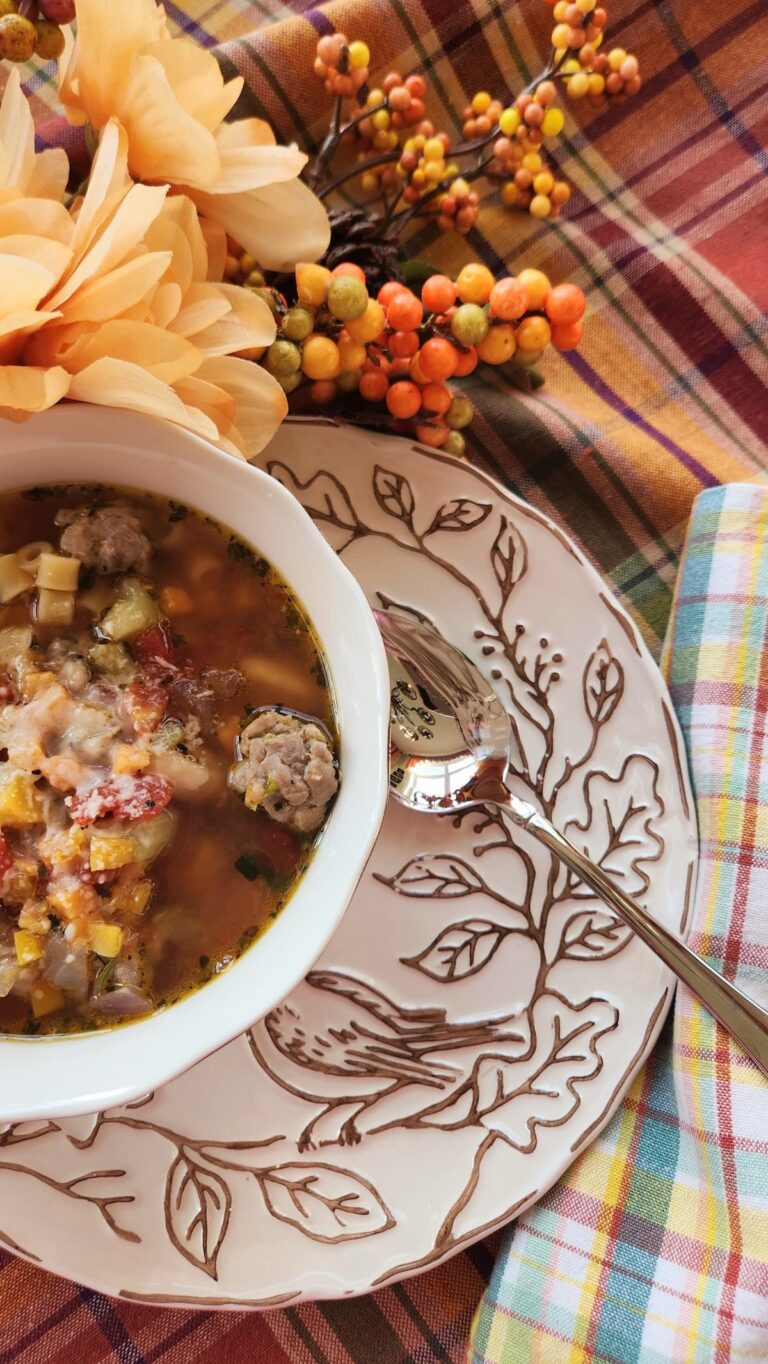 bowl of trader joes holiday hash soup with pretty bird dish under the bowl