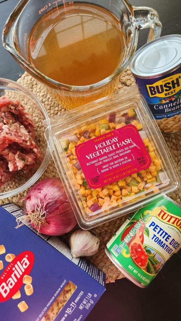 overhead photo of trader joes holiday hash vegetable soup mix with chicken broth and other ingredients