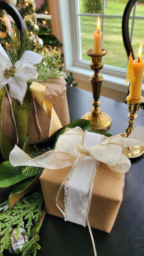 brown kraft paper wrapping with a cream bow on christmas table