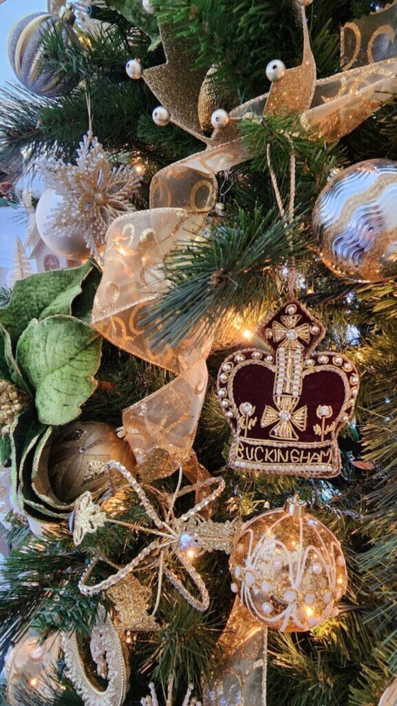 buckingham palace christmas ornament  in the shape of a crown hanging on christmas tree
