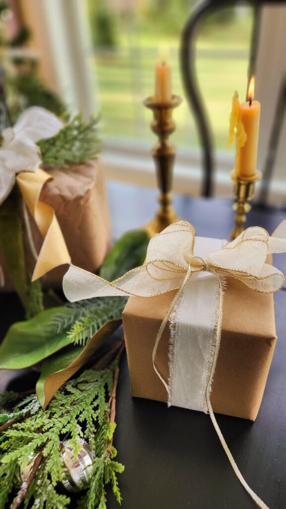 christmas gift wrapped in brown paper and tied with string on table