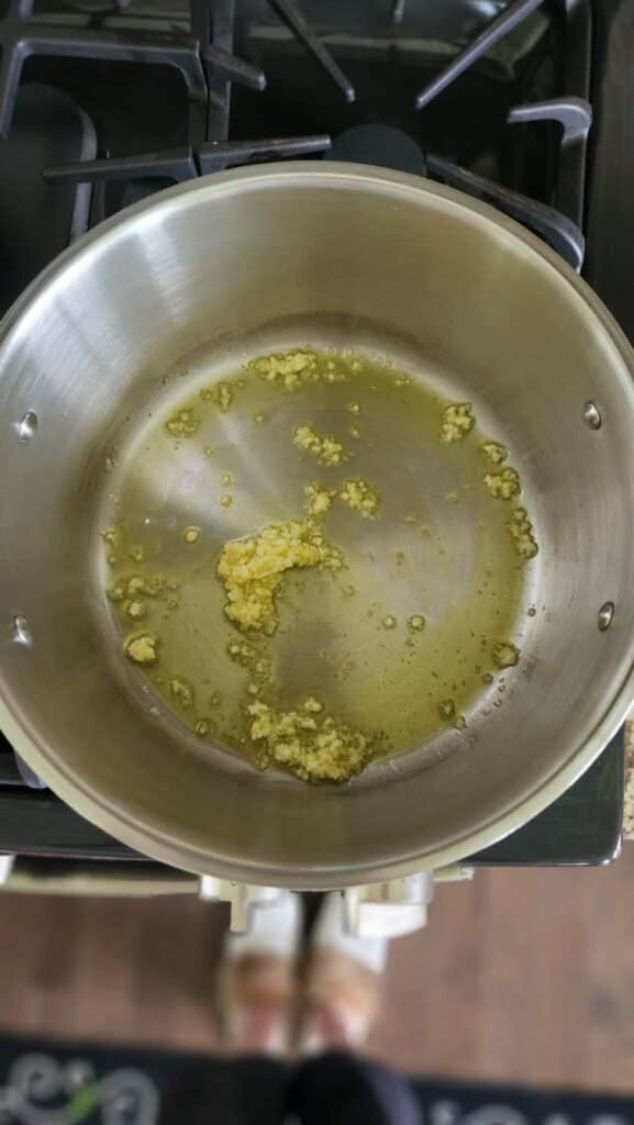 garlic sauteed in pot of oil