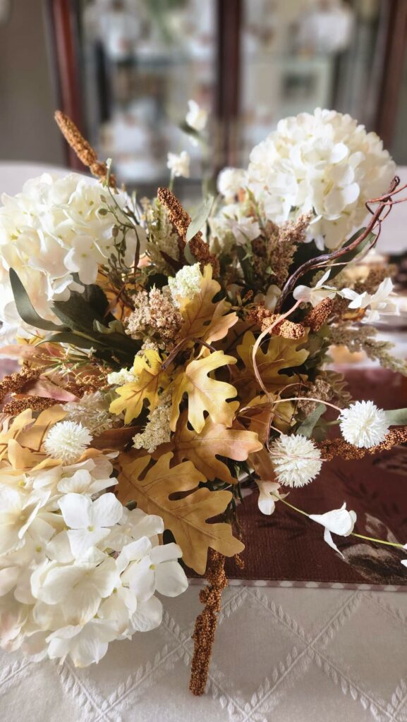 neutral fall faux florals decorated in a ivory cornacopia