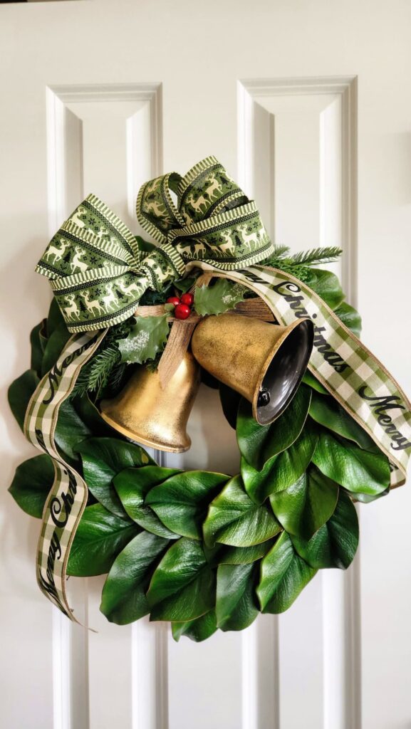 faux magnolia wreath hanging on pantry door