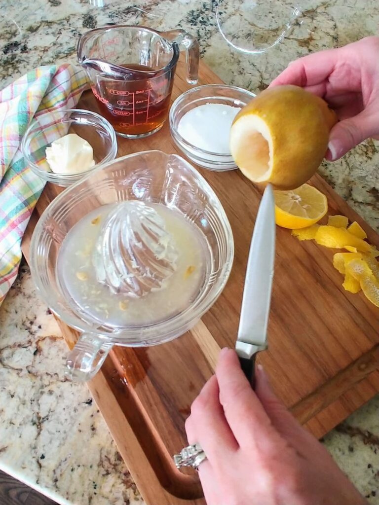 center of pear being cored out for baking