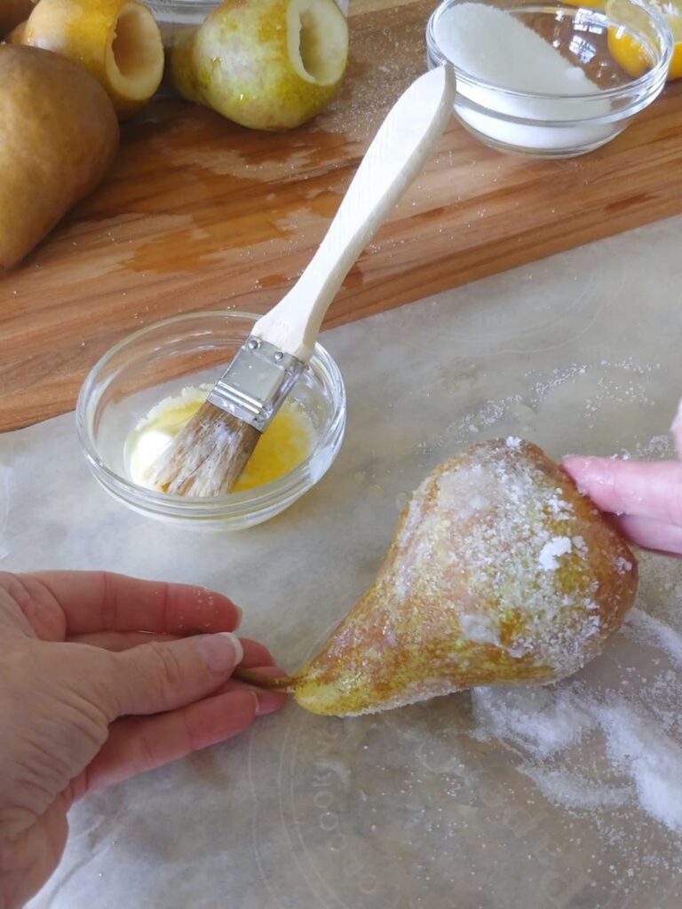 rolling pears into sugar