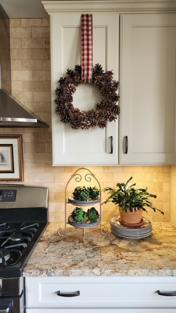 pine cone wreath on kitchen cabinet door