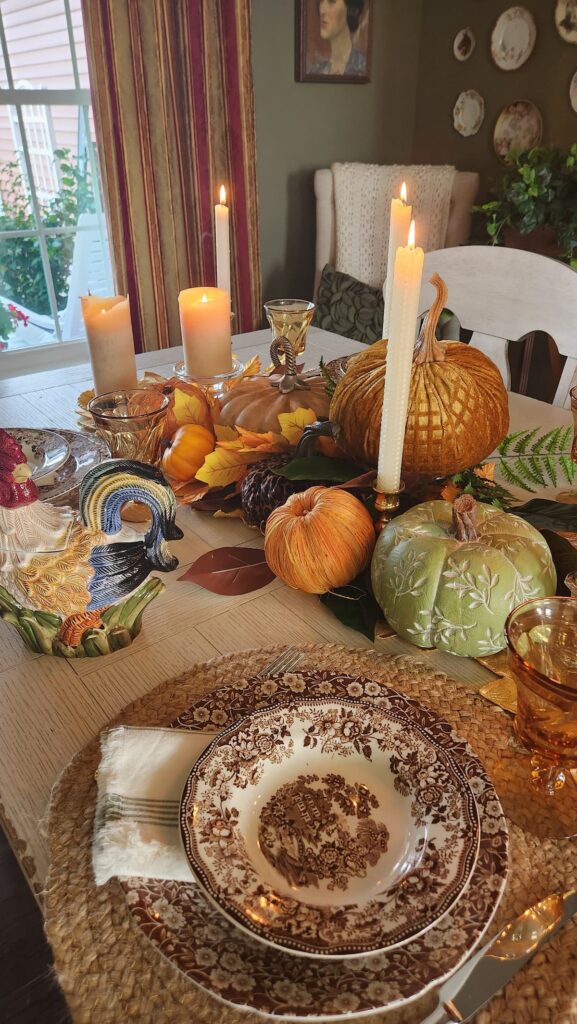 fall table with gold velvet pumpkin and candles