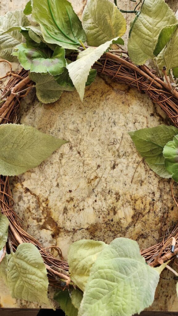 grapevine wreath with old greenery on it