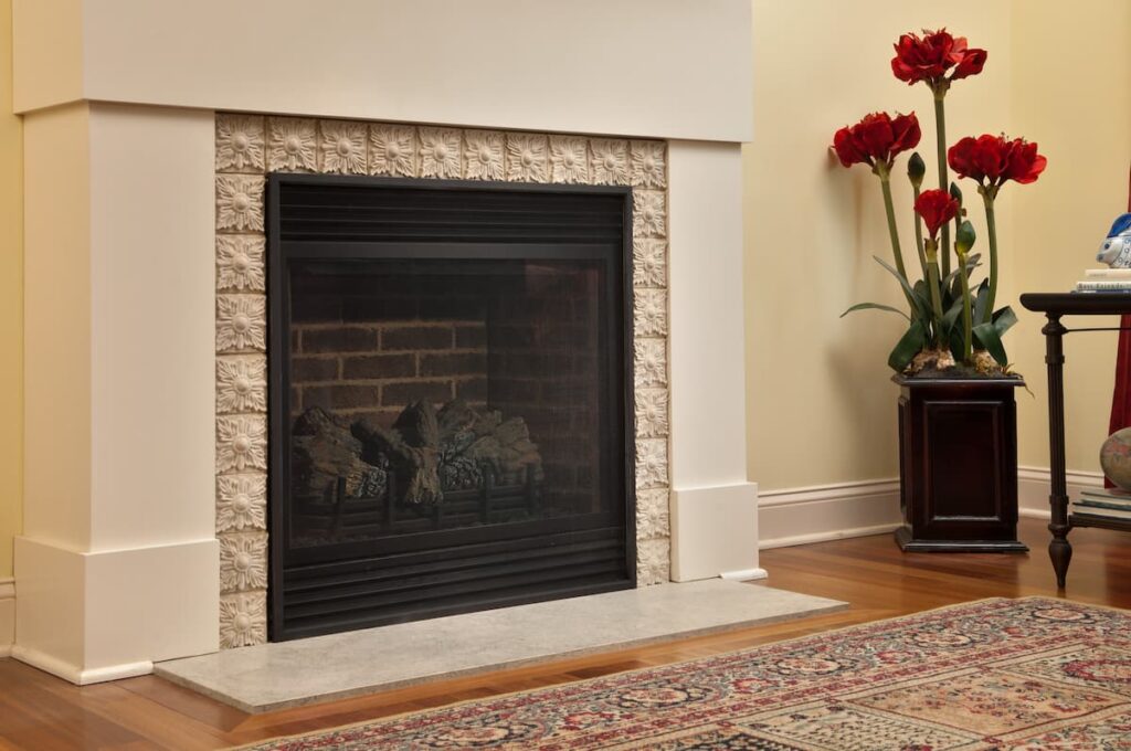 front view of a fireplace with fire safety screen on it