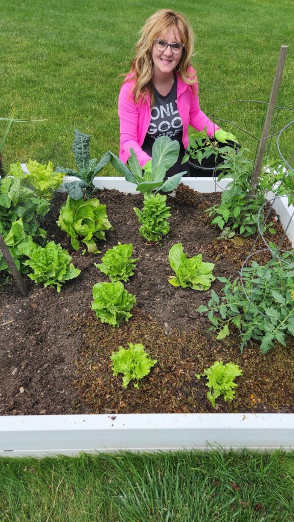 lady in garden putting down tea fertilizer