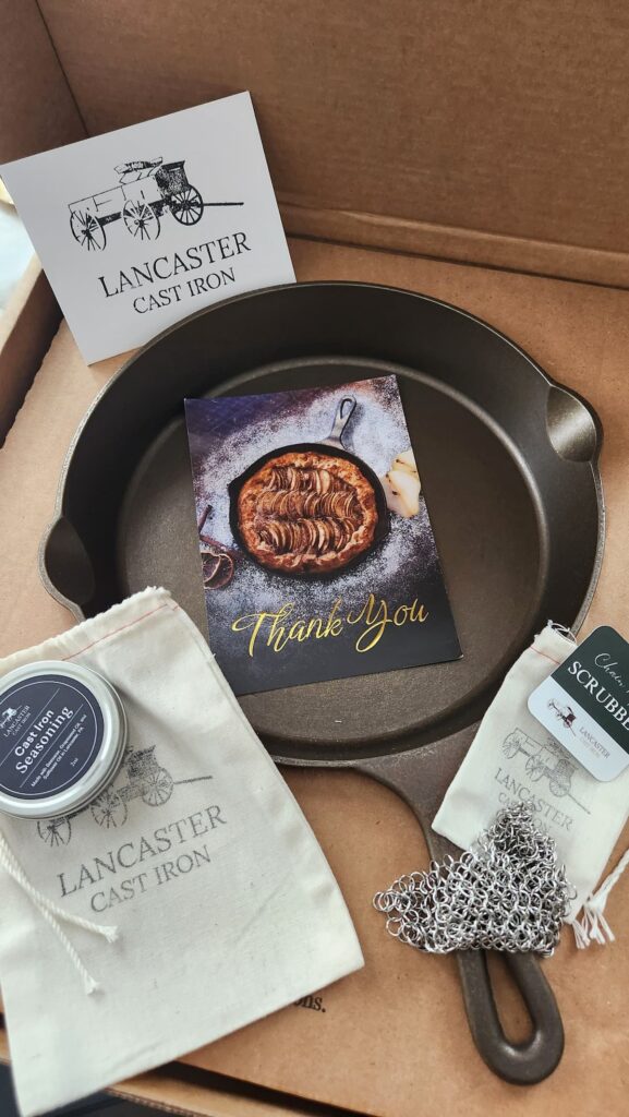 Lancaster cast iron skillet in box with accessories