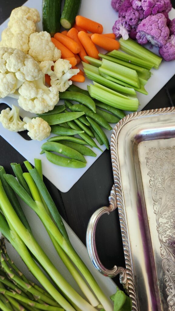 silver tray overhead with sliced vegetables 